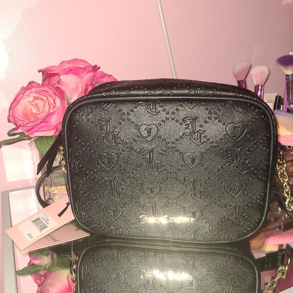 Debossed licorice camera crossbody bag